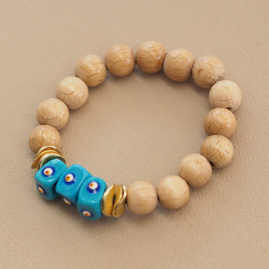 Naturholz-Armband mit drei blauen Augenperlen